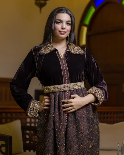 Three-quarter view of the GAZAL Rabati style brown velvet caftan with gold details.