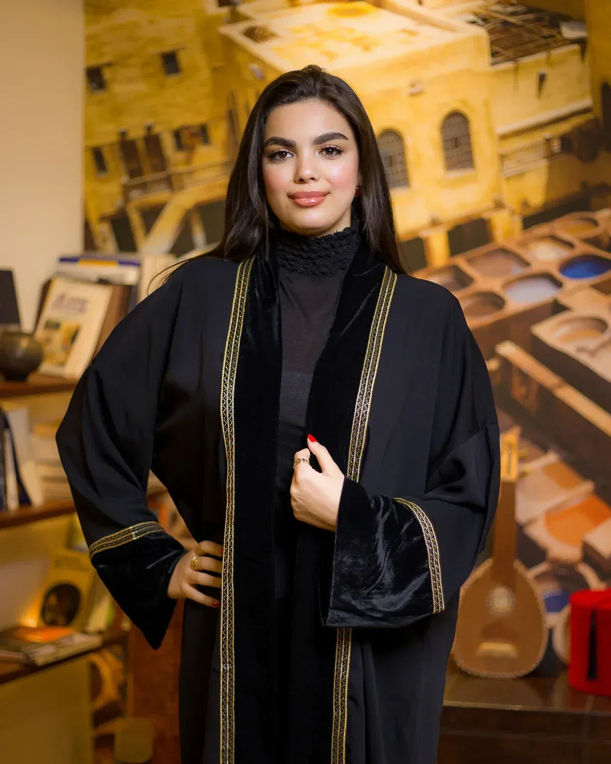 Front view of the NAGAM "Rythm" black crepe kimono featuring elegant velvet panels and intricate gold trim.