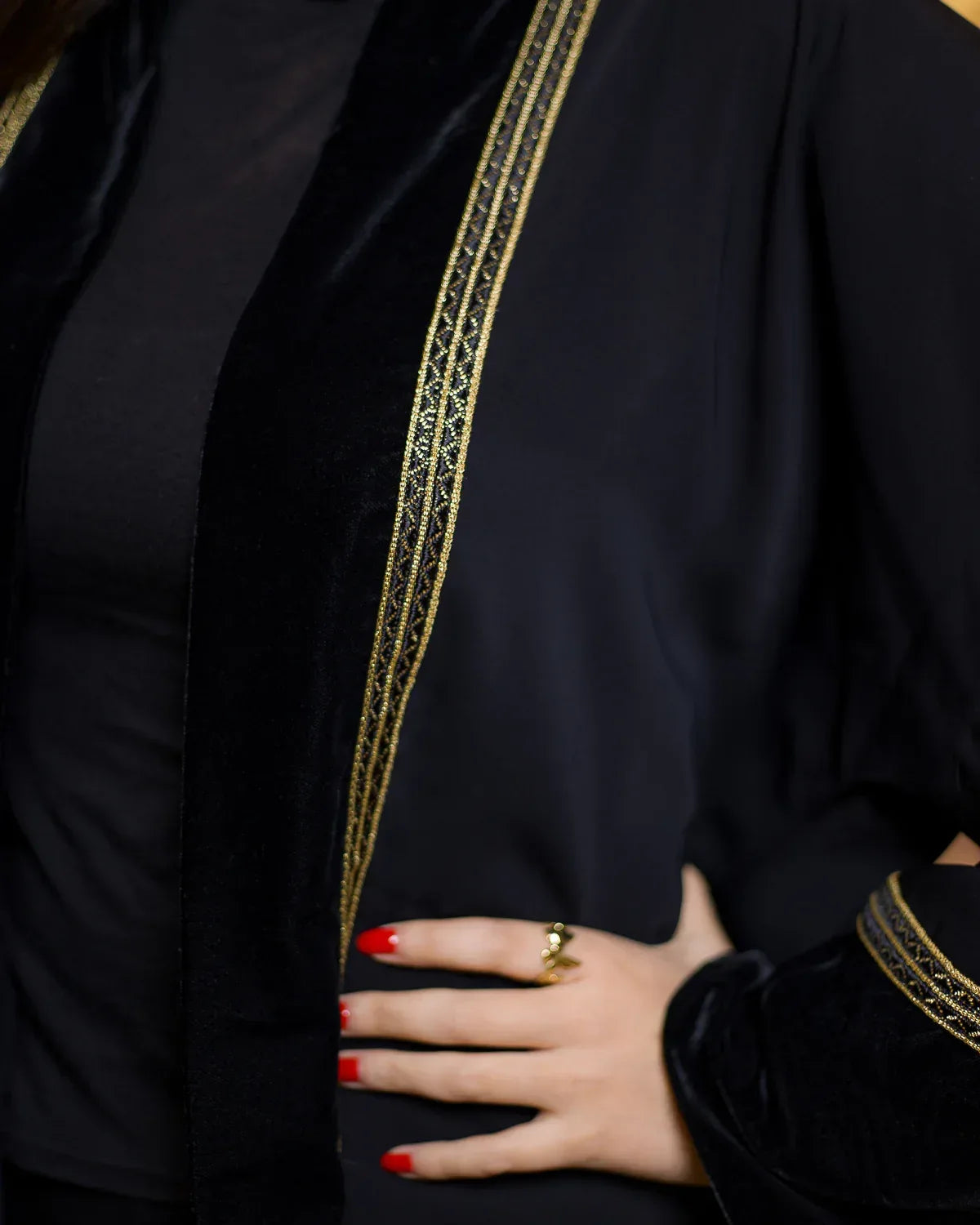 Close-up detail of the black velvet lapel and exquisite gold embroidery on the NAGAM luxury kimono.
