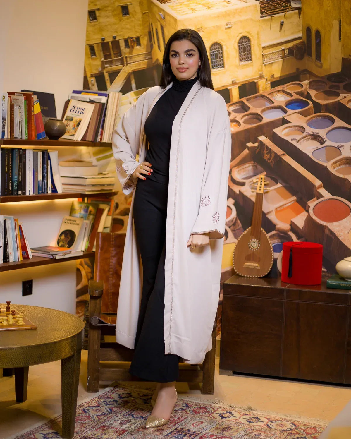Full length front view of WATAR Harmony beige kimono styled with black trousers and gold heels.